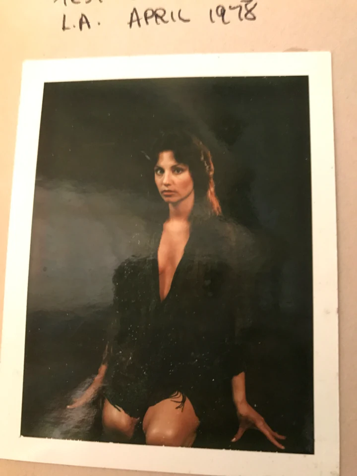 Denise McCann kneeling in a sequined outfit during a portrait test