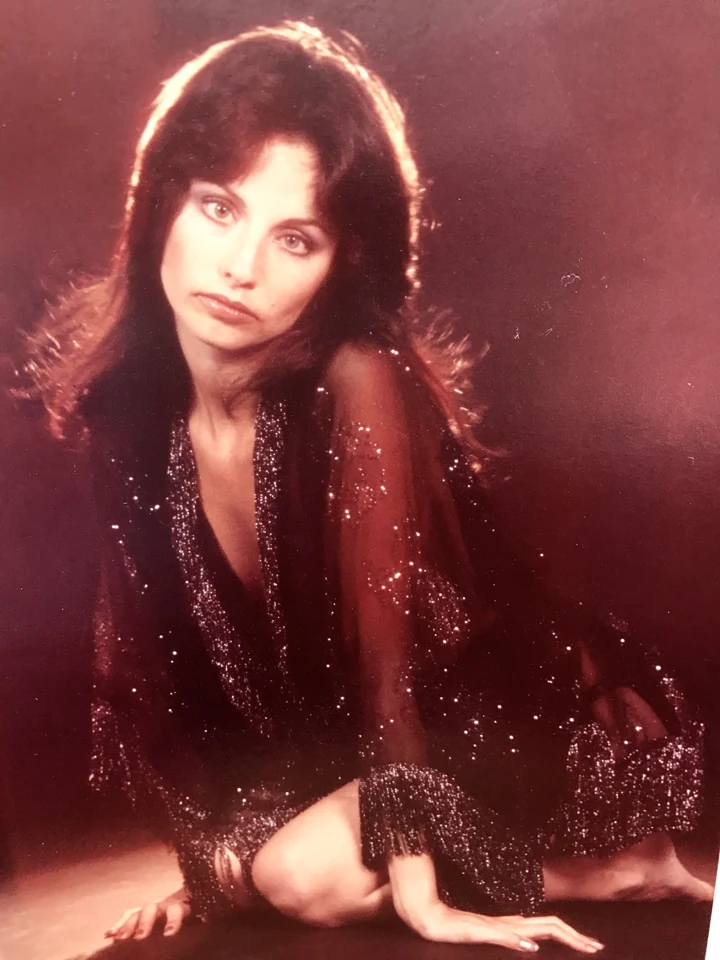 Denise McCann reclining in a sequined outfit during a portrait test