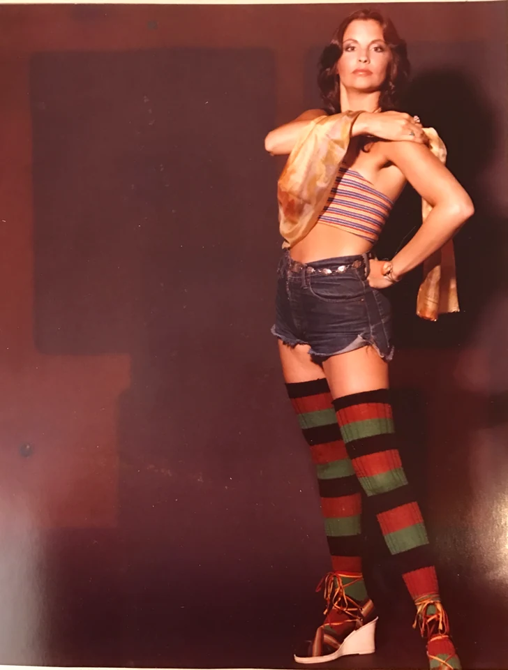 Denise McCann in striped stockings during a wardrobe test